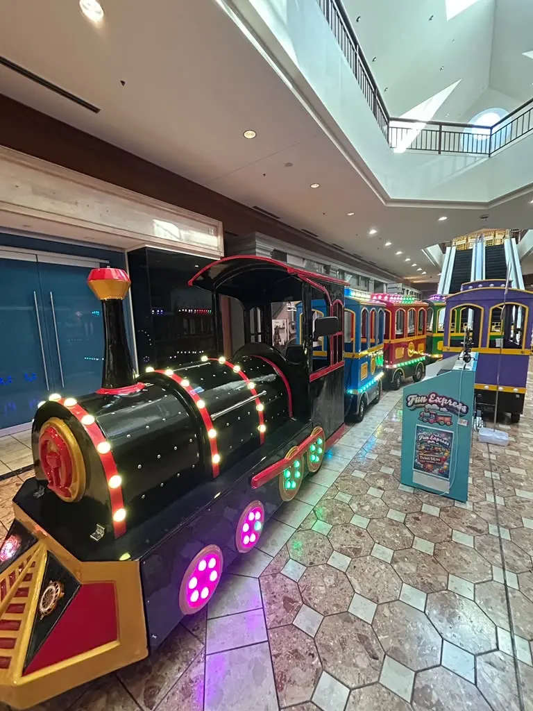 New-generation Fun Express locomotive and two passenger cars